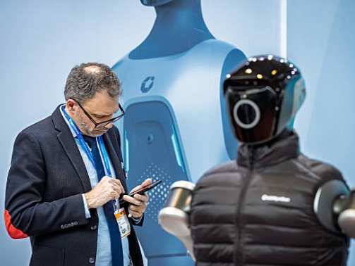 A visitor interacts with an automation solution at LogiMAT 2026 in Stuttgart, Germany, on  March 24, 2026. (Photo by Leonardo Gerzon/NurPhoto via Getty Images)