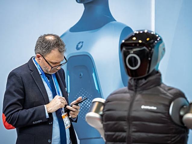 A visitor interacts with an automation solution at LogiMAT 2026 in Stuttgart, Germany, on March 24, 2026. (Photo by Leonardo Gerzon/NurPhoto via Getty Images)