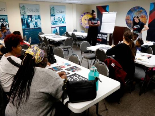 Cici Battle (L), Director and Andrea Sosa (R), Policy and Civic Engagement Manager at Young People For, hold a training session at the NAACP office in Detroit, Michigan, on October 23, 2019. - Outside the dilapidated home where Malcolm X once lived, Aaron Sims hesitates before confiding that he voted for Donald Trump. In majority-black Detroit, and nationwide, African-Americans overwhelmingly support Democrats. But in 2016 their voter participation dropped, and with next year's presidential election looming, their enthusiasm has yet to return. (Photo by JEFF KOWALSKY / AFP) (Photo by JEFF KOWALSKY/AFP via Getty Images)