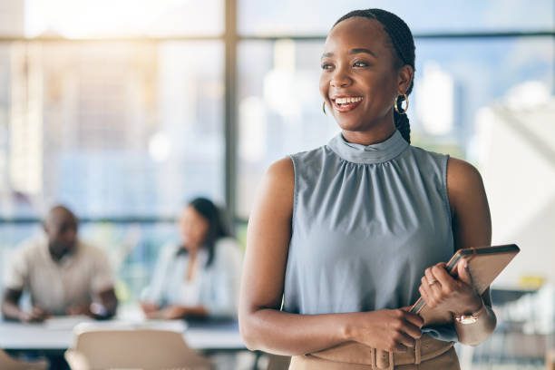 Black woman in office with tablet, smile and mockup, leadership in business meeting with professional. Workshop, project management and happy businesswoman with digital device, space and confidence.